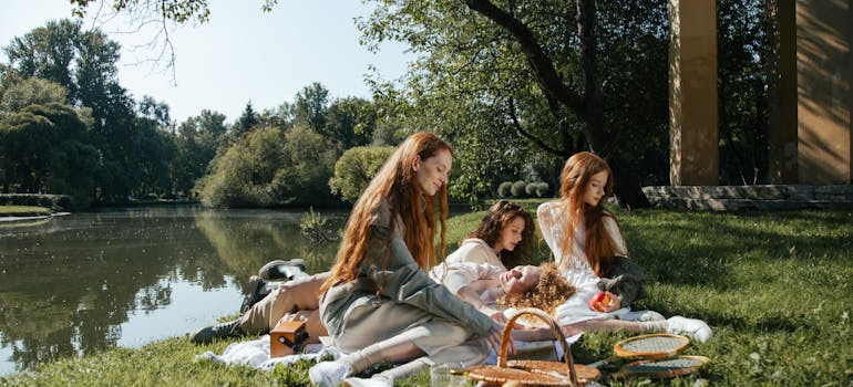 three women having a picnic at the lake